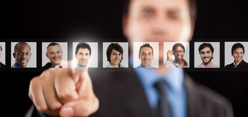 business man pointing at list of candidates