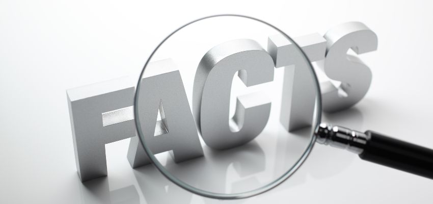 To create a compelling story, follow the three main steps: gathering facts and data, finding the elements that will be most impactful to your audience, and connecting them with the audience. A magnifier lens on top of a FACTS White Writing